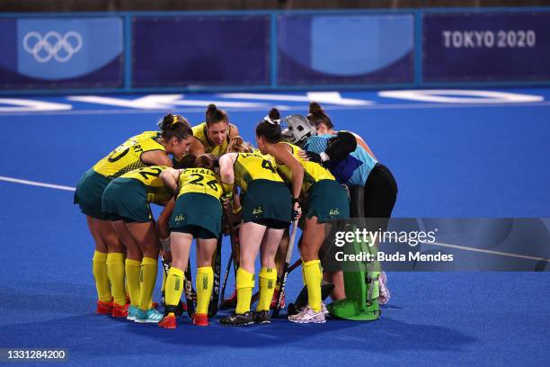 Australia players huddle on pitch during the Women's Preliminary Pool B match between New Zealand and Australia on day six of the Tokyo 2020 Olympic...