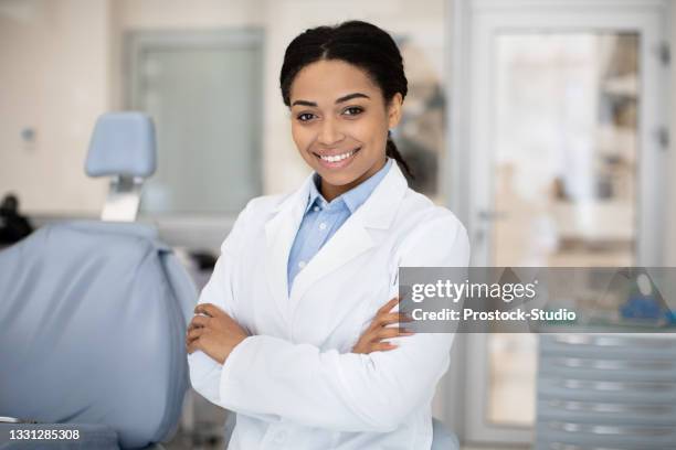 Female Dentist. Portrait Of Happy Black Stomatologist Woman Standing With Folded Arms
