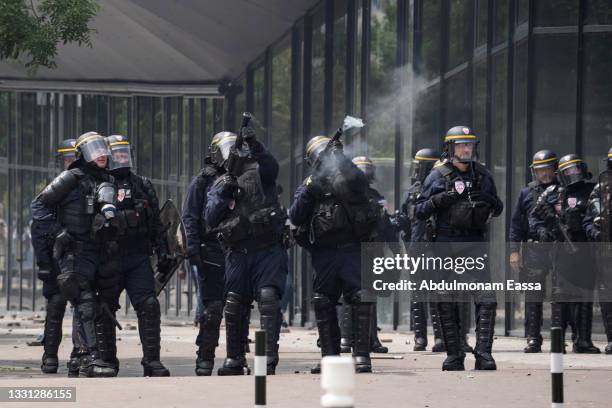 French riot police charge during clashes after a memorial march for French teenager Nahel, shot by police during a traffic control stop several days...