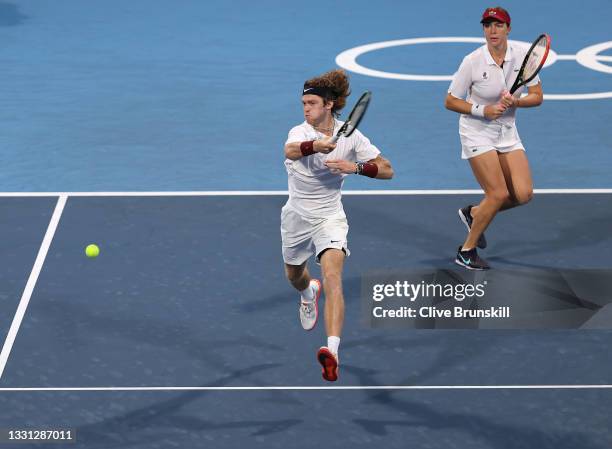 Andrey Rublev of Team ROC and Anastasia Pavlyuchenkova of Team ROC play Ben McLachlan of Team Japan and Ena Shibahara of Team Japan during their...