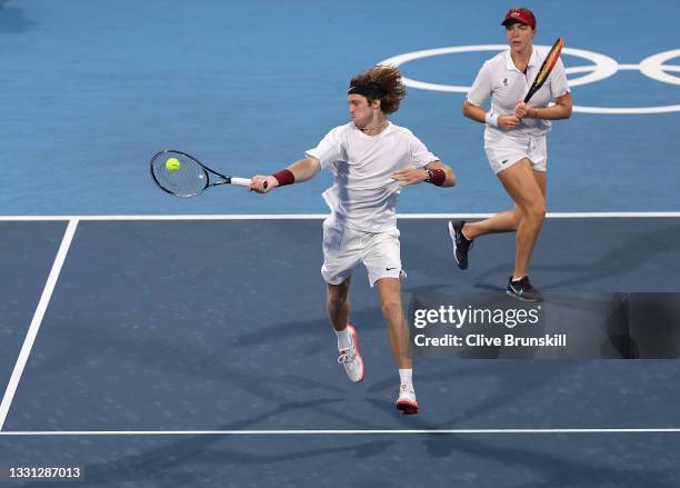 Andrey Rublev of Team ROC and Anastasia Pavlyuchenkova of Team ROC play Ben McLachlan of Team Japan and Ena Shibahara of Team Japan during their...