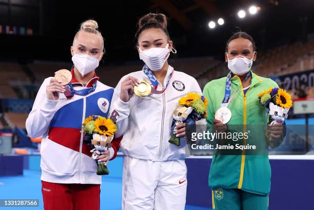 Bronze medalist Angelina Melnikova of Team ROC, gold medalist Sunisa Lee of Team United States and silver medalist Rebeca Andrade of Team Brazil pose...