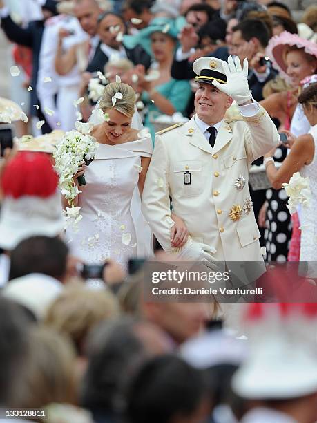 Princess Charlene of Monaco and Prince Albert II of Monaco leave the religious ceremony of the Royal Wedding of Prince Albert II of Monaco to...