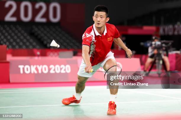 Chen Long of Team China competes against Lee Zii Jia of Team Malaysia during a Men's Singles Round of 16 match on day six of the Tokyo 2020 Olympic...
