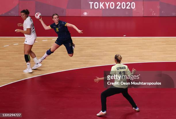 Elin Hansson of Team Sweden shoots and scores a goal against Amandine Leynaud of Team France as Laura Flippes of Team France looks on during of the...