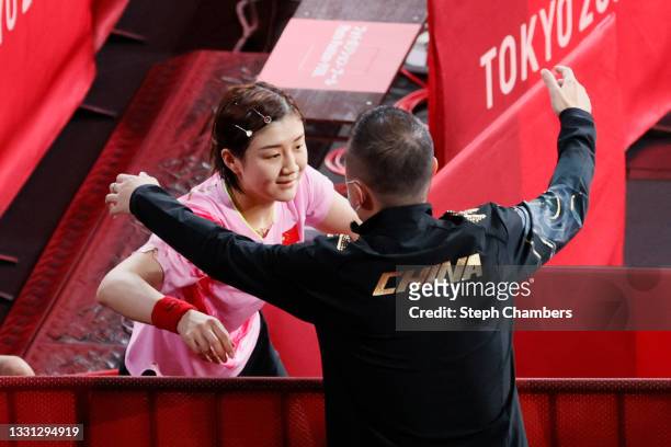 Chen Meng of Team China hugs her coach after winning her Women's Singles Gold Medal match on day six of the Tokyo 2020 Olympic Games at Tokyo...