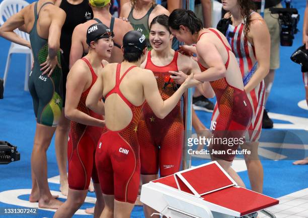 Junxuan Yang, Yufei Zhang, Bingjie Li and Muhan Tang of Team China celebrate the victory and Gold Medal during the 4 x 200m Freestyle Relay final on...