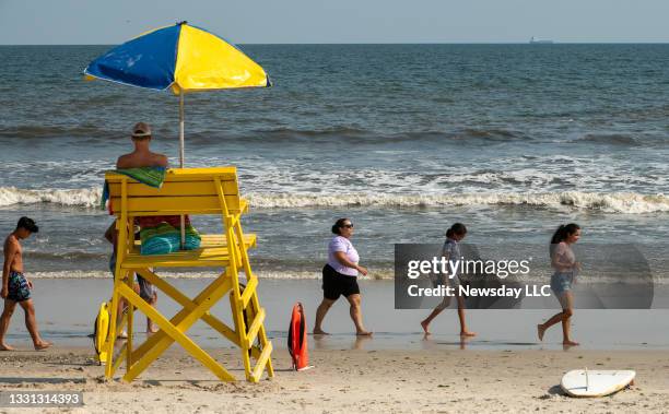 Bathers were asked not to go in the water after lifeguards spotted sharks at Lido Beach West in Lido Beach, New York, on July 28, 2021.