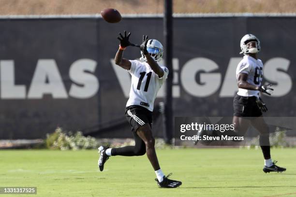 Henry Ruggs III of the Las Vegas Raiders catches a pass during training camp at the Las Vegas Raiders Headquarters/Intermountain Healthcare...