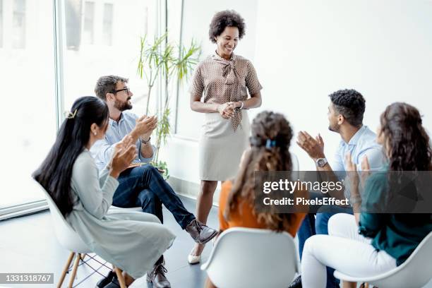 group psychotherapy session - mental health services stock pictures, royalty-free photos & images
