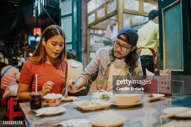 sweetheart, i know this is your favorite menu. i will give you some - stock photo - bangkok nightlife stock pictures, royalty-free photos & images