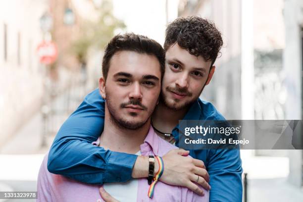 boyfriend hugging gay beloved from back - union gay bildbanksfoton och bilder