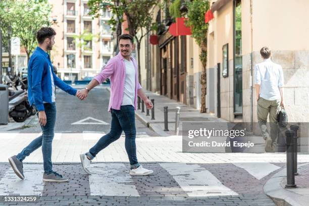 positive gay couple crossing road on zebra - union gay bildbanksfoton och bilder