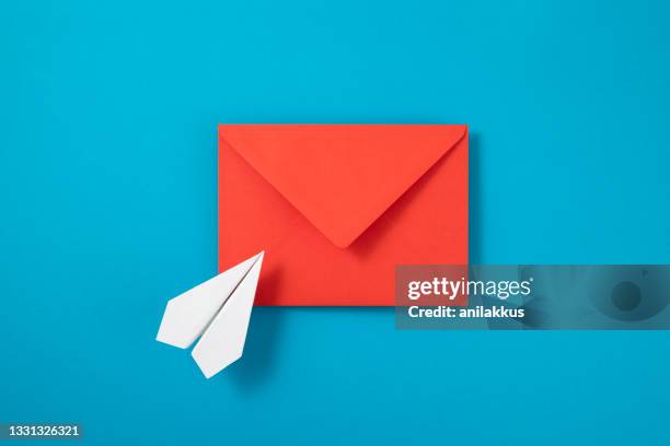 sending e-mail concept - blue envelope stock pictures, royalty-free photos & images