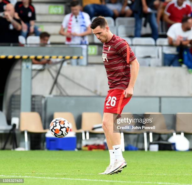 Andy Robertson of Liverpool warming up before the Pre Season match between Hertha BSC and Liverpool at Tivoli Stadion Tirol on July 29, 2021 in...