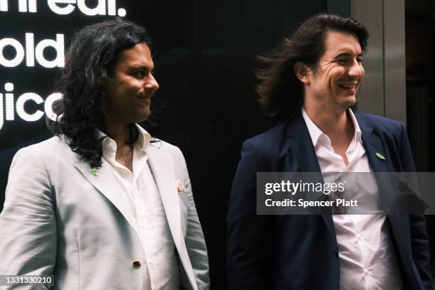 Baiju Bhatt and Vlad Tenev, founders of the online brokerage Robinhood, walk along Wall Street after going public with an IPO earlier in the day on...