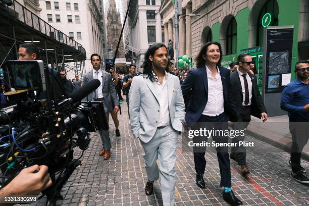 Baiju Bhatt and Vlad Tenev, founders of the online brokerage Robinhood, walk along Wall Street after going public with an IPO earlier in the day on...