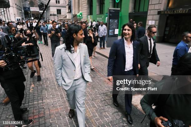 Baiju Bhatt and Vlad Tenev, founders of the online brokerage Robinhood, walk along Wall Street after going public with an IPO earlier in the day on...