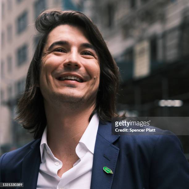 Vlad Tenev, CEO of the online brokerage Robinhood, walks along Wall Street after going public with an IPO earlier in the day on July 29, 2021 in New...