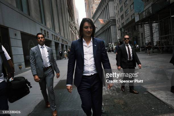 Vlad Tenev, CEO of the online brokerage Robinhood, walks along Wall Street after going public with an IPO earlier in the day on July 29, 2021 in New...