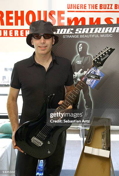 Musician Joe Satriani poses during his in-store appearance at Wherehouse Music on August 10, 2002 in Los Angeles, California.