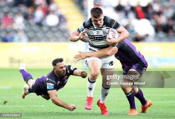 Connor Wynne of Hull FC is tackled by Luke Gale of Leeds Rhinos during the Betfred Super League match between Hull FC and Leeds Rhinos at KCOM...