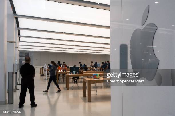 People visit the Apple store in the Oculus Mall in Manhattan on July 29, 2021 in New York City. Numerous stores in the mall, including the Apple...