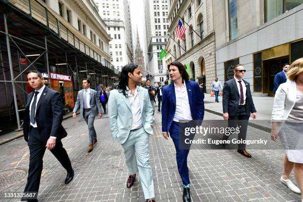 Baiju Bhatt and Vlad Tenev walk on Wall Street during Robinhood Markets IPO Listing Day on July 29, 2021 in New York City.