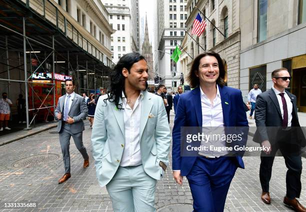 Baiju Bhatt and Vlad Tenev walk on Wall Street during Robinhood Markets IPO Listing Day on July 29, 2021 in New York City.