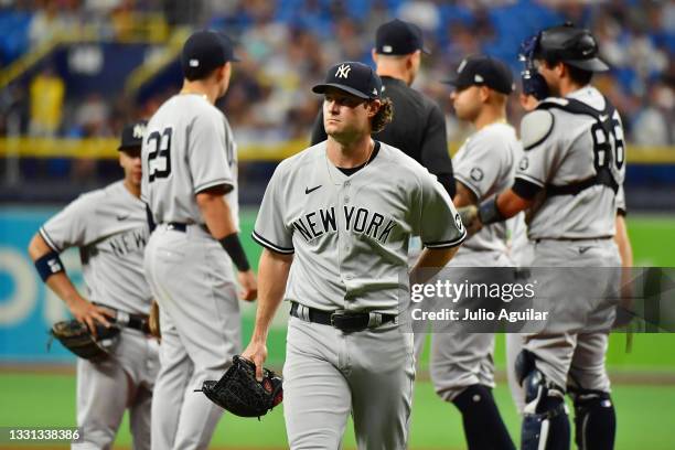 Gerrit Cole of the New York Yankees walks to the dugout after being relieved in the sixth inning against the Tampa Bay Rays at Tropicana Field on...