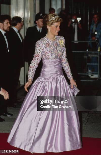 British Royal Diana, Princess of Wales , wearing a Catherine Walker evening gown and the Spencer family tiara, arrives for a State Banquet on the...