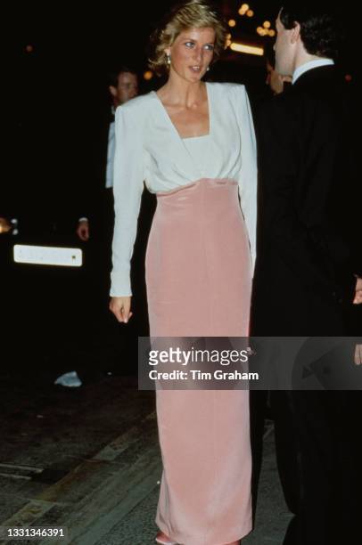 British Royal Diana, Princess of Wales , wearing a pink-and-white Catherine Walker evening gown, attends a performance of 'Swan Lake' by the Bolshoi...