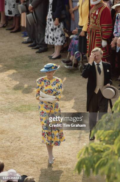 High angle view of British Royal Princess Alexandra of Kent and her husband British businessman Sir Angus Ogilvy attending the garden party, hosted...