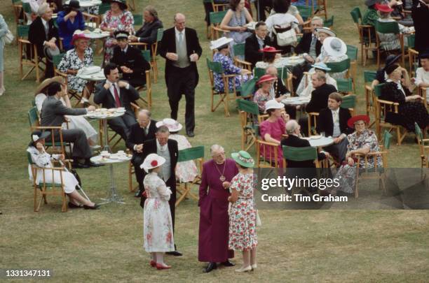 High angle view of unspecified guests attending the garden party, hosted by Queen Elizabeth II and Prince Philip, Duke of Edinburgh, at Buckingham...