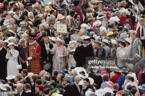 High angle view of unspecified guests attending the garden party, hosted by Queen Elizabeth II and Prince Philip, Duke of Edinburgh, at Buckingham...