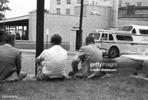 Marshals sit across from the bus station where a Freedom Ride touched off a bloody mob uprising.