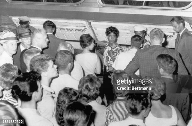 Freedom riders are shown arriving at the Midwest Bus Terminal. Police arrested them about ten minutes after they entered the waiting room of the...