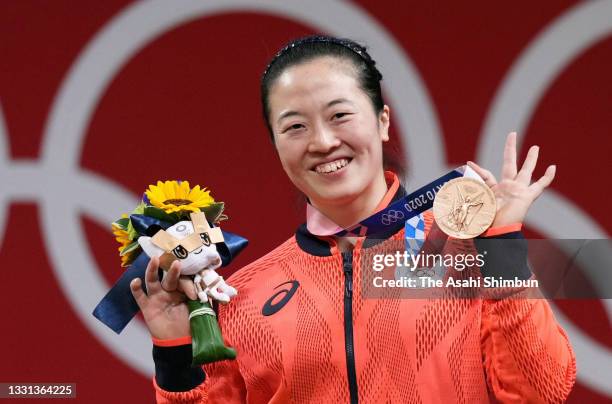 Bronze medalist Mikiko Ando of Team Japan poses on the podium at the medal ceremony for the Women’s 59kg on day four of the Tokyo 2020 Olympic Games...