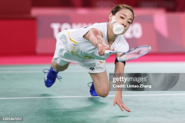 Nozomi Okuhara of Team Japan competes against He Bing Jiao of Team China during a Women's Singles Quarterfinal match on day seven of the Tokyo 2020...