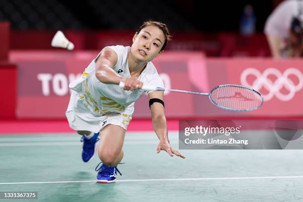 Nozomi Okuhara of Team Japan competes against He Bing Jiao of Team China during a Women's Singles Quarterfinal match on day seven of the Tokyo 2020...