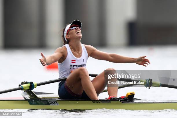 Magdalena Lobnig of Team Austria celebrates winning the bronze medal during the Women's Single Sculls Final A on day seven of the Tokyo 2020 Olympic...