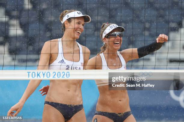 Alix Klineman of Team United States celebrates with April Ross after defeating Team Netherlands during the Women's Preliminary - Pool B beach...