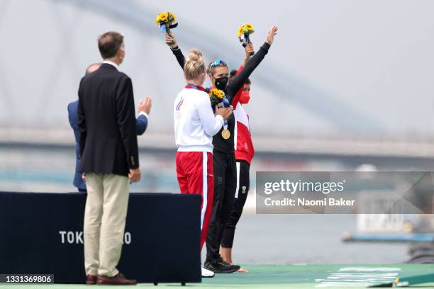 Silver medalist Hanna Prakatsen of Team ROC, gold medalist Emma Twigg of Team New Zealand and bronze medalist Magdalena Lobnig of Team Austria pose...