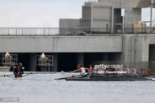 Silver medalist Ella Greenslade of Team New Zealand Women's Eight reaches out to gold medalist Emma Twigg of Team New Zealand Women's Single Sculls...