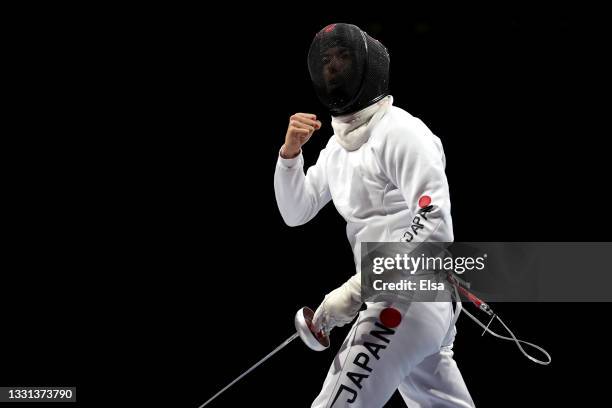 Kazuyasu Minobe of Team Japan celebrates during his match against Team United States in Men's Épée Team Table of 16 on day seven of the Tokyo 2020...