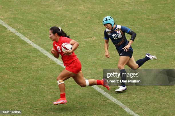 Feifei Yang of Team China breaks away under pressure from Honoka Tsutsumi of Team Japan in the Women’s pool C match between Team China and Team Japan...