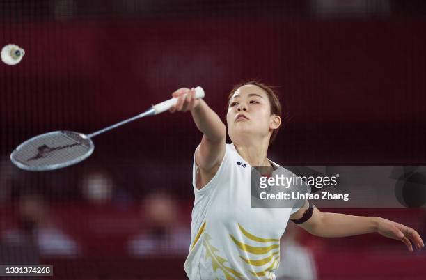 Nozomi Okuhara of Team Japan competes against He Bing Jiao of Team China during a Women's Singles Quarterfinal match on day seven of the Tokyo 2020...