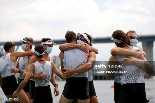 Team New Zealand hug after winning the gold medal during the Men's Eight Final A on day seven of the Tokyo 2020 Olympic Games at Sea Forest Waterway...