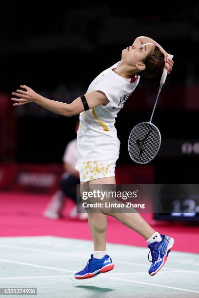 Nozomi Okuhara of Team Japan competes against He Bing Jiao of Team China during a Women's Singles Quarterfinal match on day seven of the Tokyo 2020...