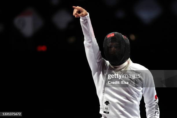 Kazuyasu Minobe of Team Japan celebrates a point during his match against Team United States in Men's Épée Team Table of 16 on day seven of the Tokyo...